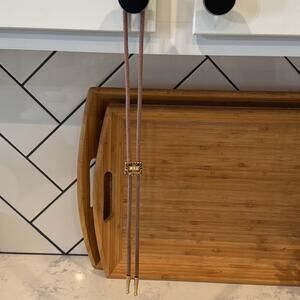 Un Branded bolo Tie tan with gold black accent nylon braded western rodeo